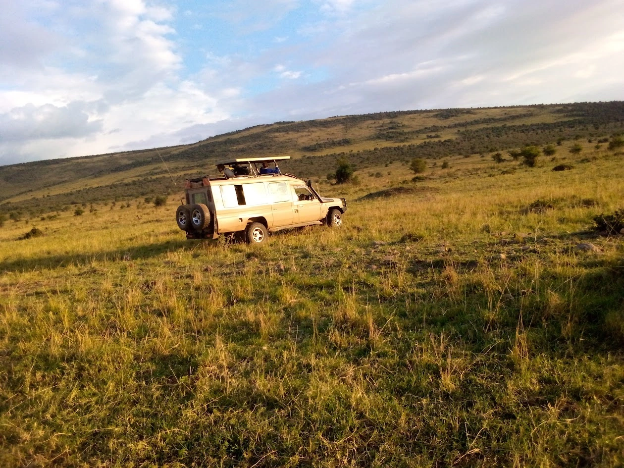 Maasai Mara safari Land Cruiser on a game drive in Kenya